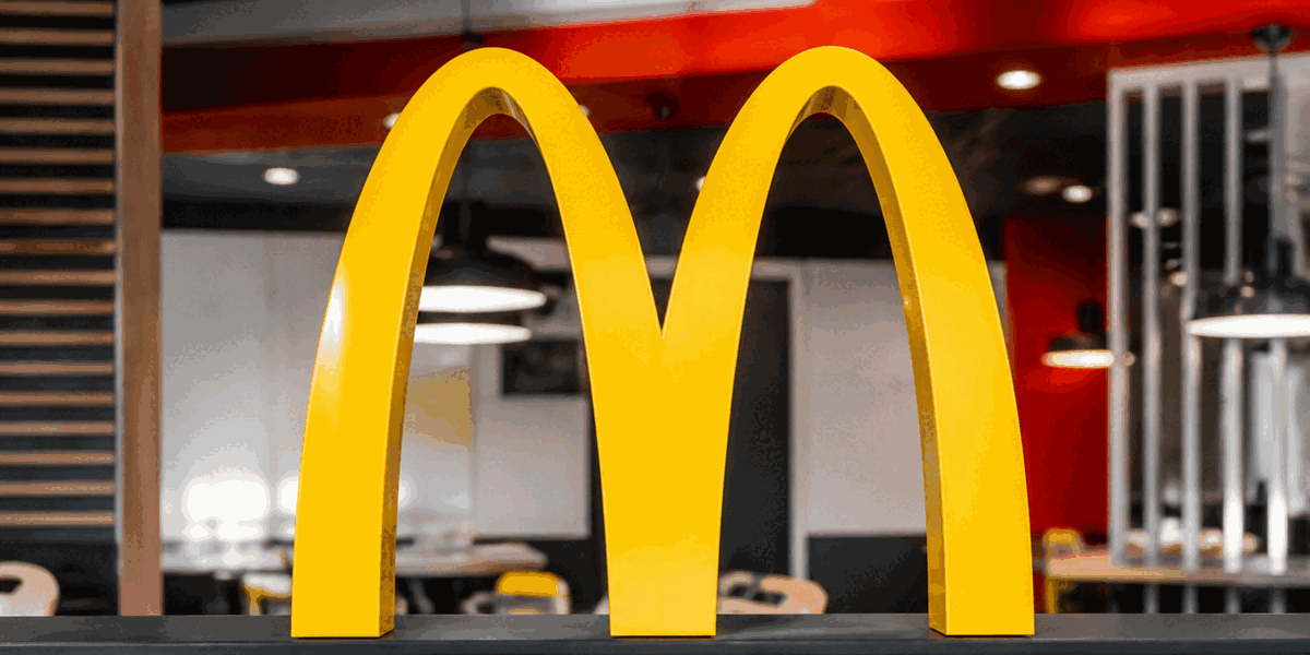 McDonald's Golden Arches logo displayed in modern restaurant setting