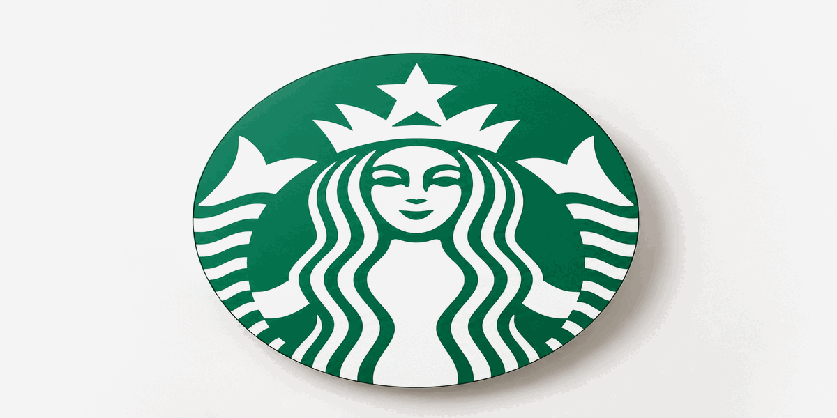 Starbucks siren logo in iconic green centered on a clean editorial hero background