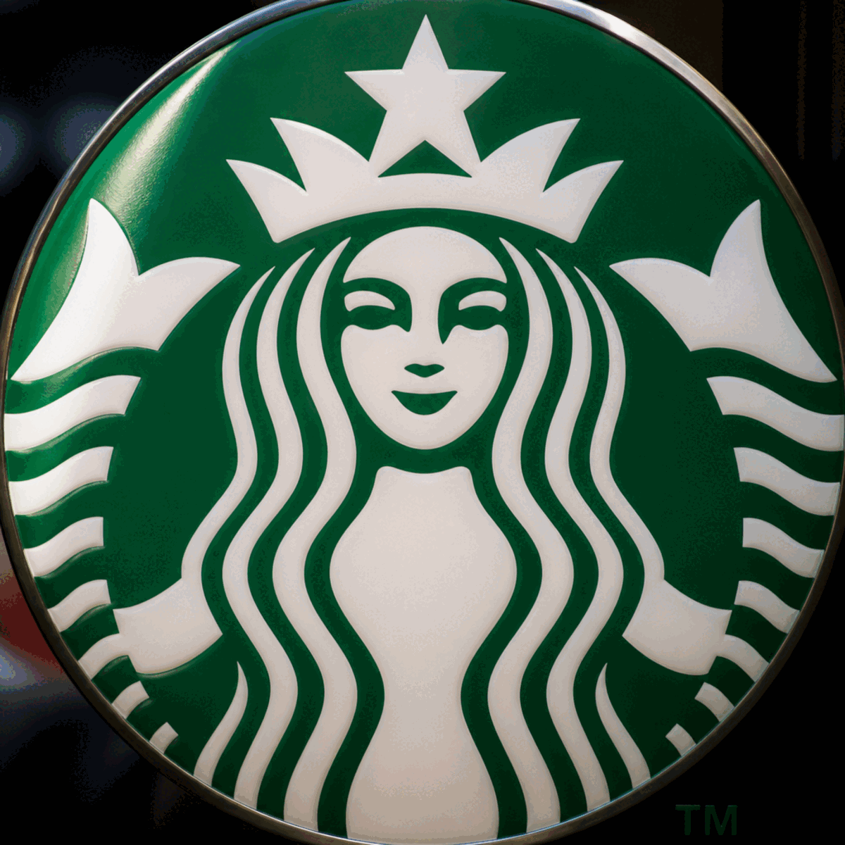 Detailed view of the Starbucks siren mythological figure highlighting design elements and symmetrical composition