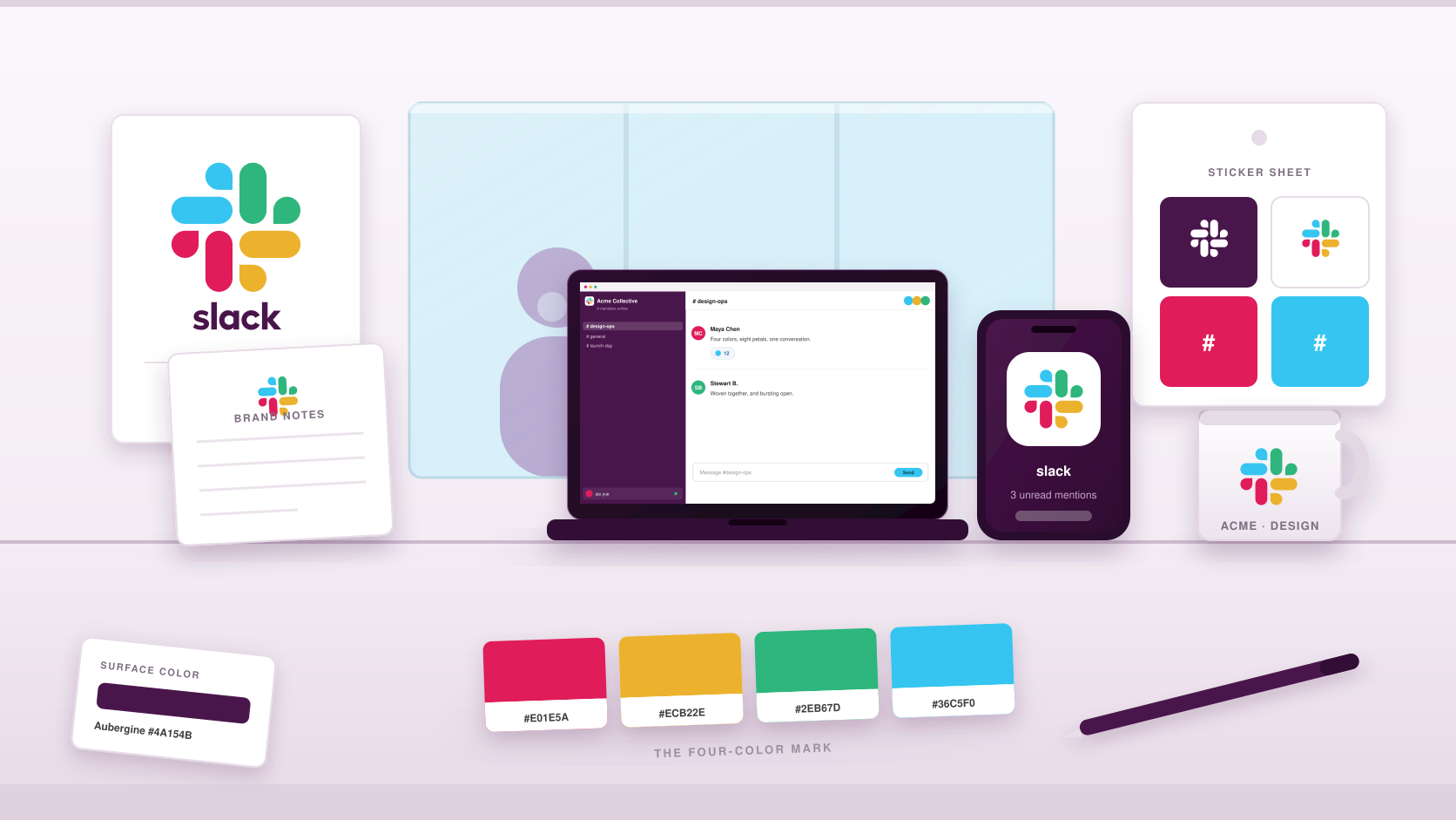 Slack four-color eight-petal flower identity applied across a laptop workspace, smartphone app icon, notepad, mug, wall poster, sticker sheet and color swatches